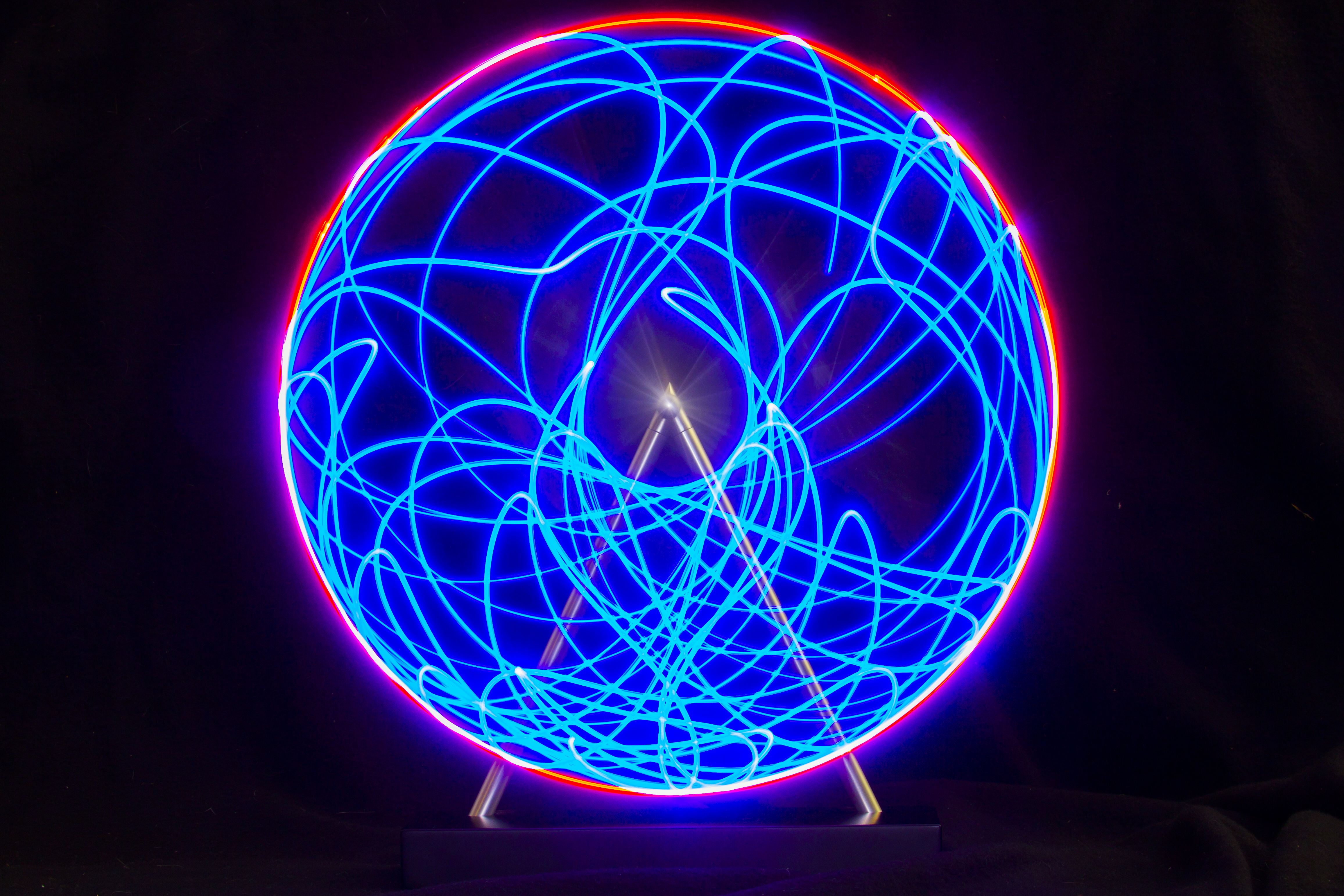 Blue
light trail of the tip of the second part of a double pendulum, with
the path looking chaotic and somewhat uniformly spread out over an annulus